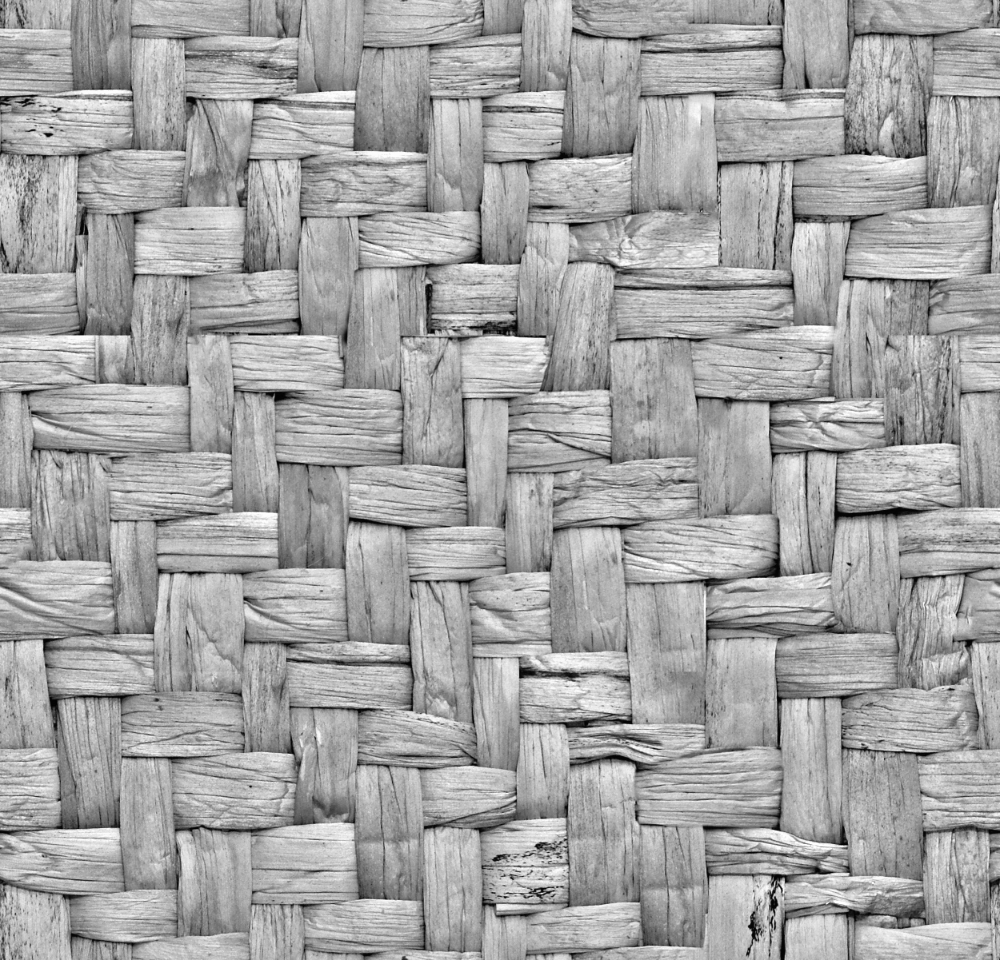 woven grey wood strips forming a rustic, rough textured pattern with visible grain
