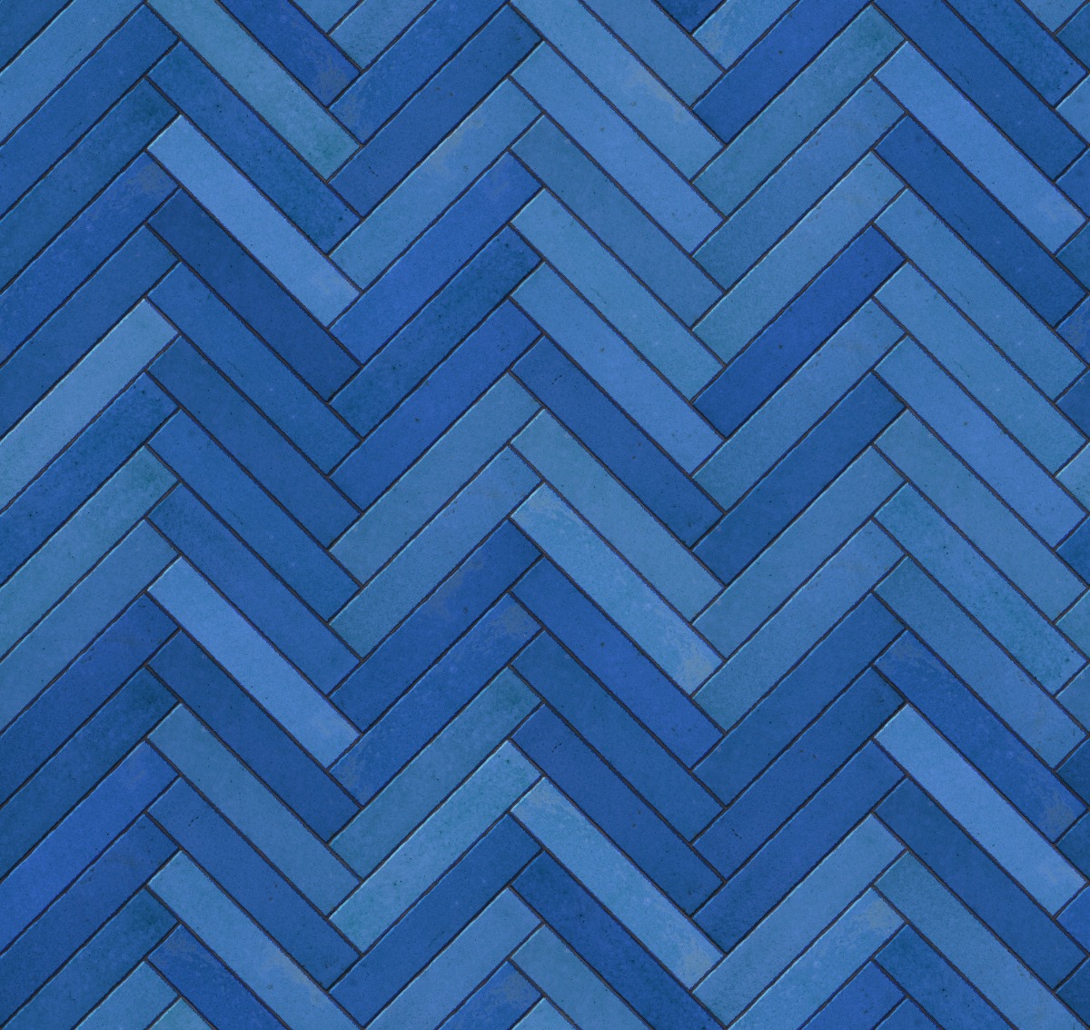 blue ceramic tiles arranged in a herringbone pattern with matte finish and subtle color variations