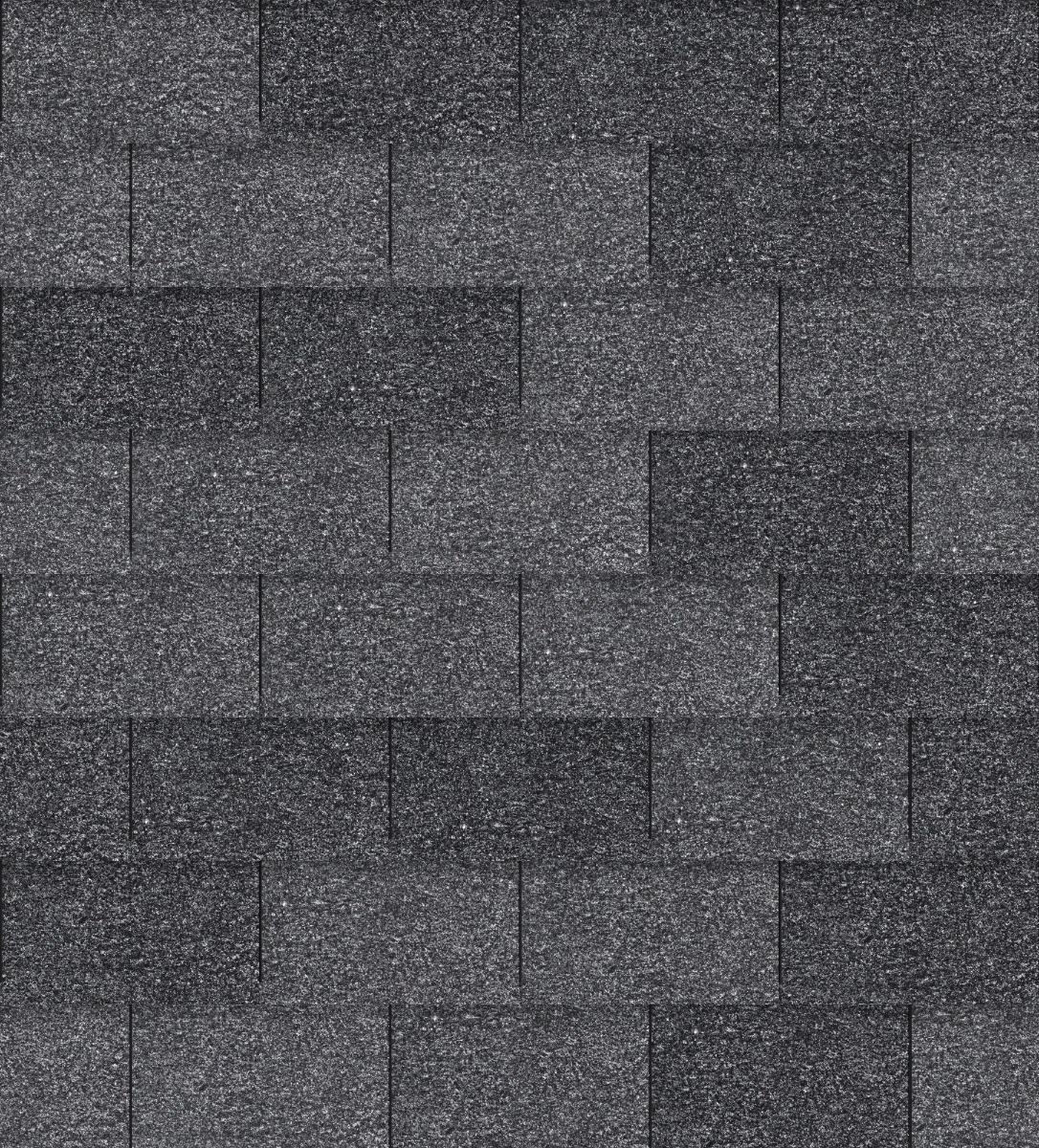 dark grey bitumen roof shingles with granular texture arranged in stretcher bond pattern