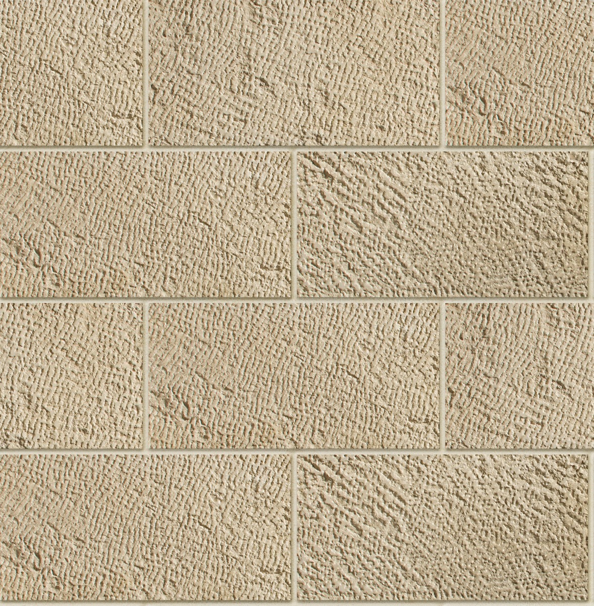 Beige rectangular concrete blocks with rough chiseled texture arranged in staggered pattern with grout lines