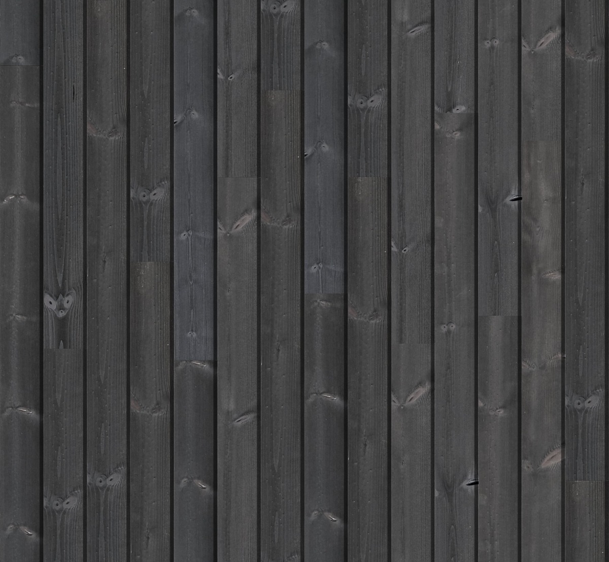Dark charred redwood wood planks with visible grain and knots arranged vertically for wall cladding