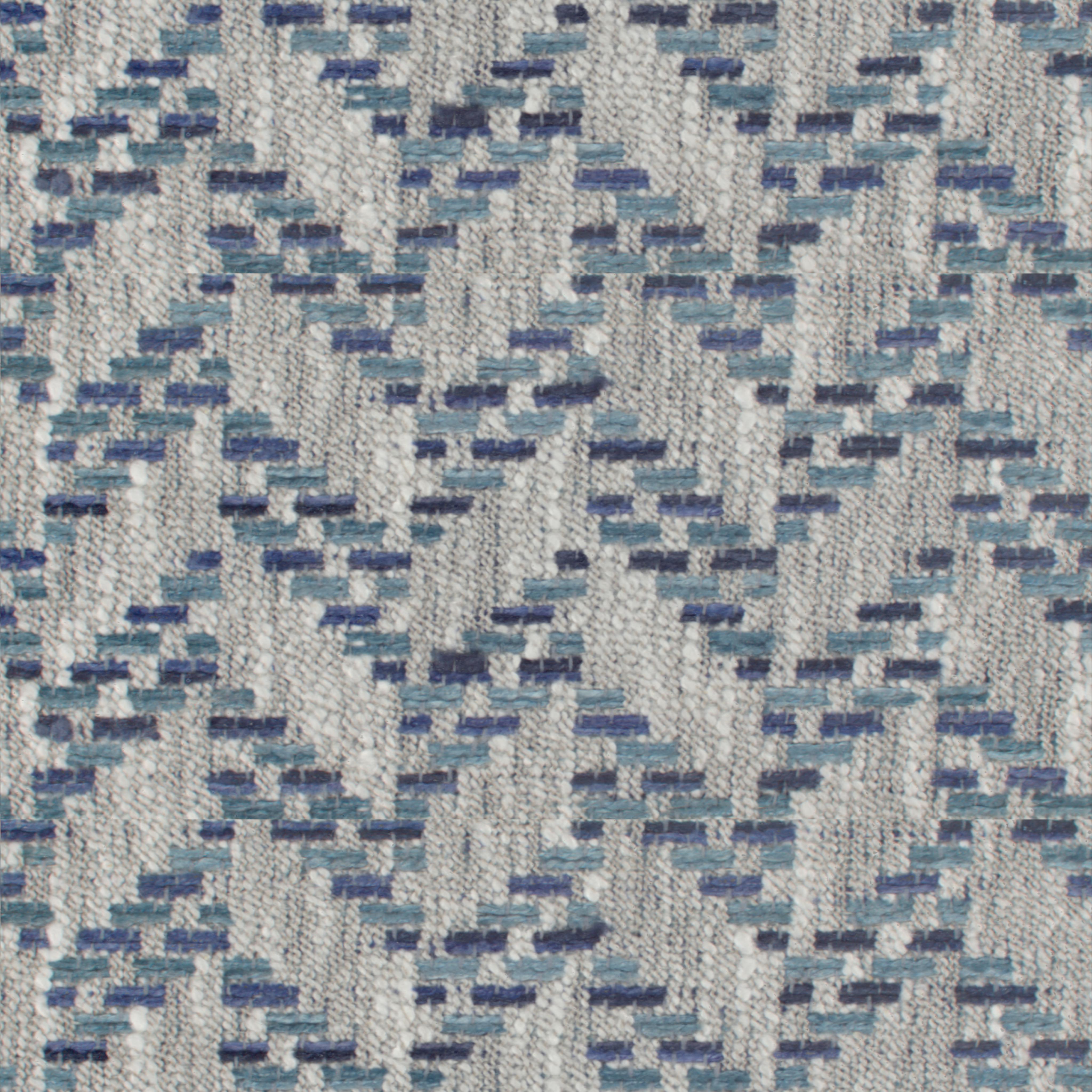 close-up of blue and grey woven tweed upholstery fabric with geometric pattern
