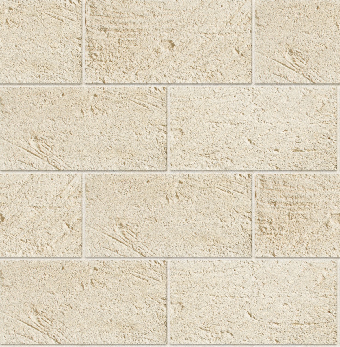 Beige carved rectangular stone tiles arranged in a staggered pattern with rough textured surface and grout lines