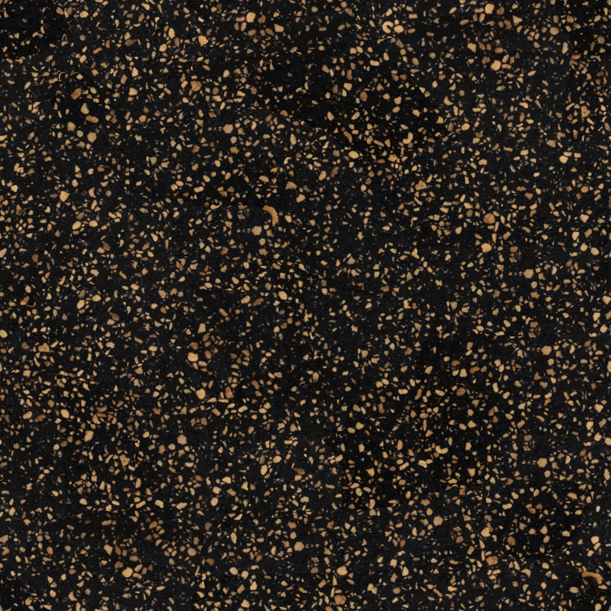 dark black composite surface with scattered natural cork granules in a speckled organic pattern