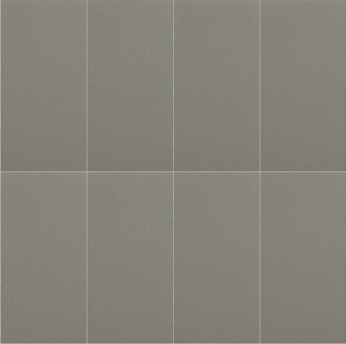 smooth grey concrete plates arranged in a neat grid pattern with thin joints