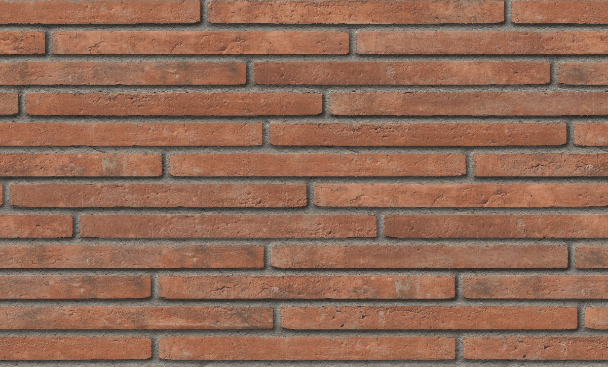 staggered red clay brick wall with gray mortar joints and rough texture