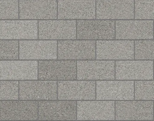 gray concrete masonry unit wall in stretcher bond pattern with rough speckled surface and mortar joints
