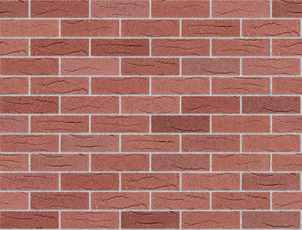 Red clay brick wall with creased texture and light grey mortar in stretcher bond pattern