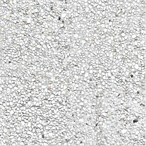 white exposed aggregate concrete surface with small irregular stones embedded in cement matrix
