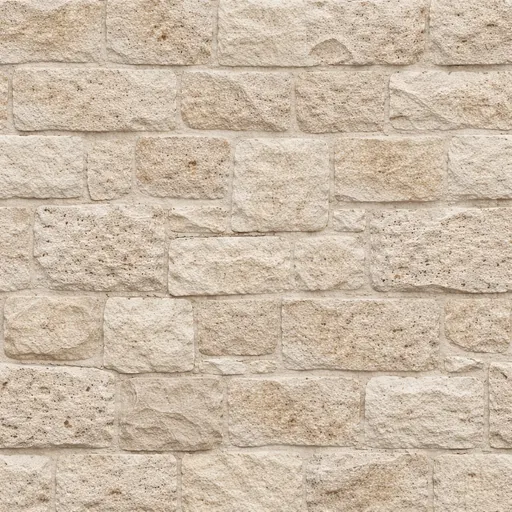 Beige limestone bricks with rough surface arranged in a running bond pattern, suitable for wall cladding.