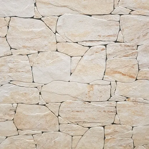 Cream-colored limestone stones with natural texture and irregular shapes, arranged in a rustic wall pattern.