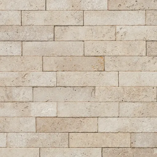 Light beige limestone bricks with a rough surface, arranged in a running bond pattern, suitable for wall cladding.