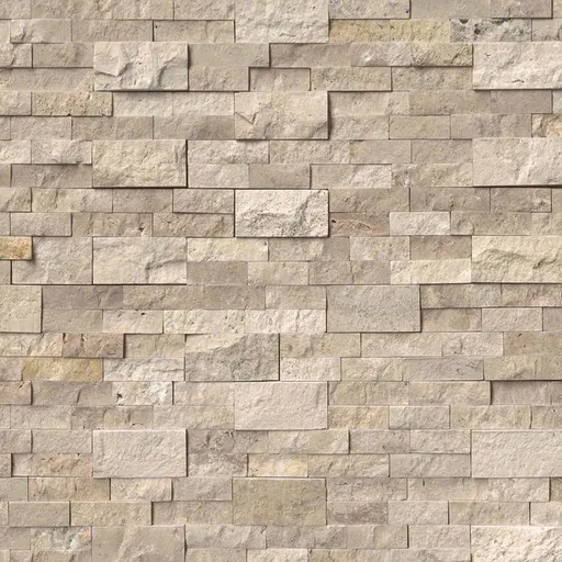 Beige travertine stone wall with staggered rectangular blocks and mixed smooth and rough textures